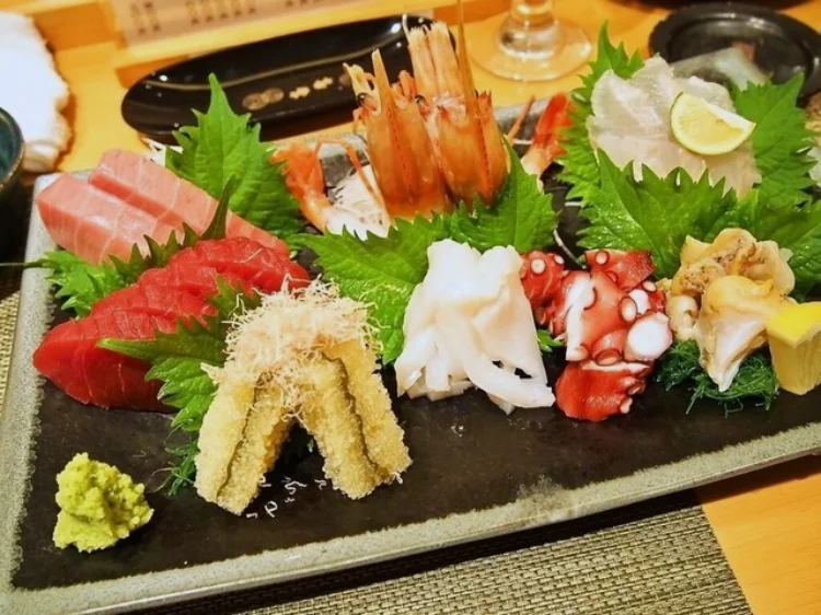 A large assortment of fresh sashimi with shrimp and tuna